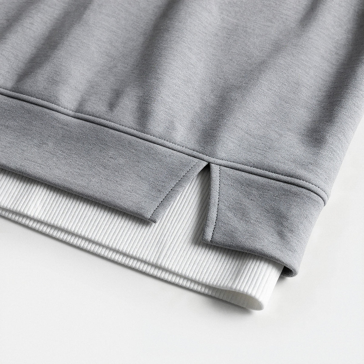 Close-up of the split hem with ribbed under-layer