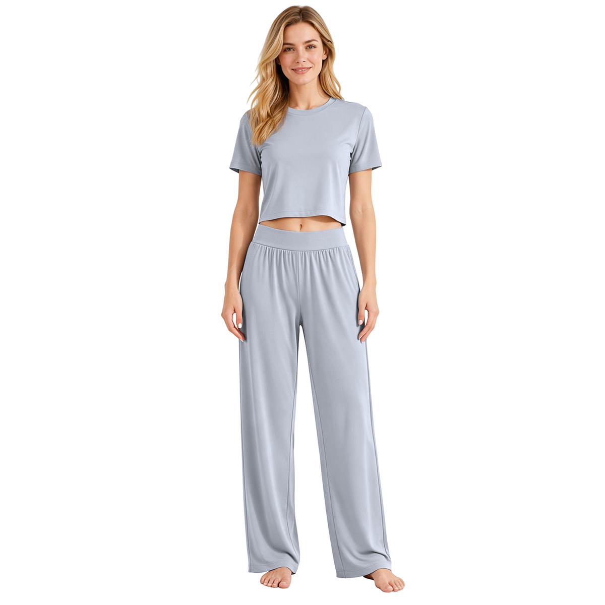 Gray colourway — AI-generated studio image of an adult model wearing the two-piece pyjama set (short cropped crew-neck tee with exposed midriff, wide elastic high-waist wide-leg trousers)
